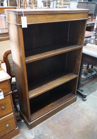 An Edwardian oak open bookcase, length 78cm, width 25cm, height 122cm